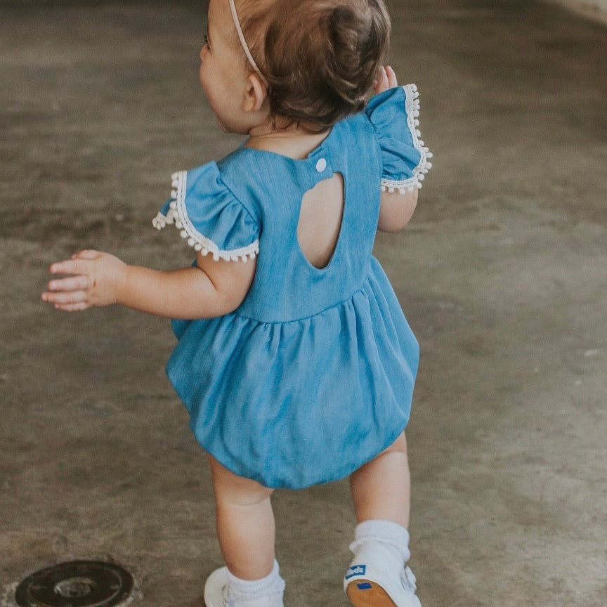 Infant Girl's Denim Chambray Romper with Pom Pom Trim