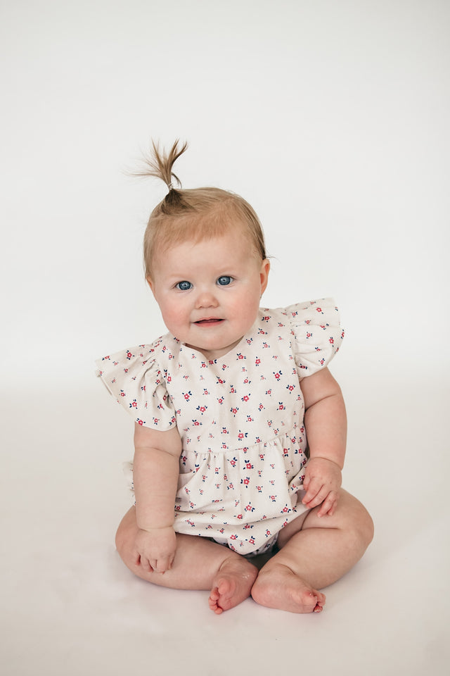 red and white floral print romper
