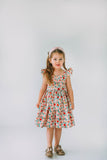 little girls pink red and gold floral twirl dress with flutter sleeves