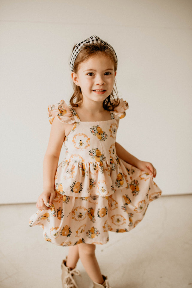 Girl's Bee Print Peplum Twirl Dress