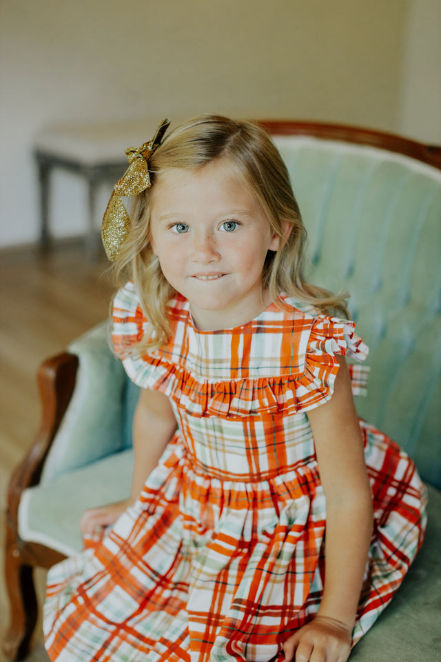 Little Girl's Bright Red and Green Christmas Tartan Ruffle Bib Dress
