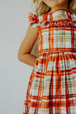 Little Girl's Bright Red and Green Christmas Tartan Ruffle Bib Dress