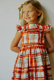 Little Girl's Bright Red and Green Christmas Tartan Ruffle Bib Dress