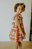 Little Girl's Bright Red and Green Christmas Tartan Ruffle Bib Dress