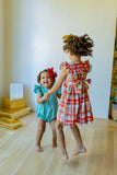 Little Girl's Bright Red and Green Christmas Tartan Ruffle Bib Dress