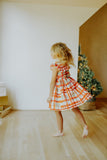 Little Girl's Bright Red and Green Christmas Tartan Ruffle Bib Dress