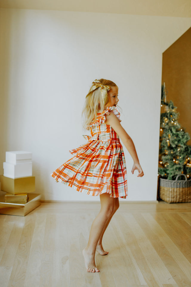 Little Girl's Bright Red and Green Christmas Tartan Ruffle Bib Dress