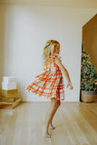 Little Girl's Bright Red and Green Christmas Tartan Ruffle Bib Dress