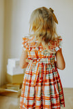 Little Girl's Bright Red and Green Christmas Tartan Ruffle Bib Dress