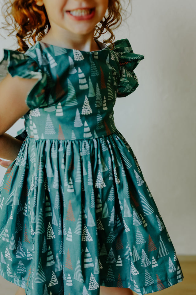 little girls muted hygge tree christmas dress