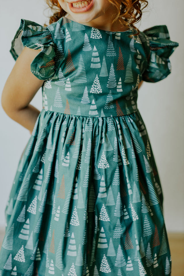 little girls muted hygge tree christmas dress