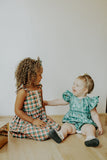Little Girls Muted Plaid Christmas Dress with Ivory Trim