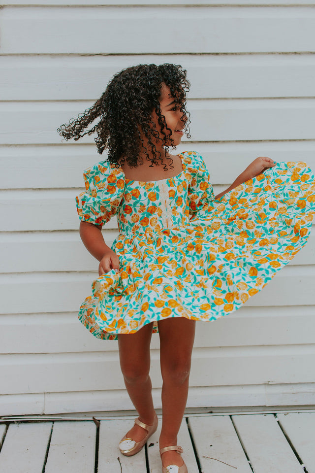 little girls orange print little cutie twirl dress