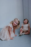 matching dress and romper for sisters